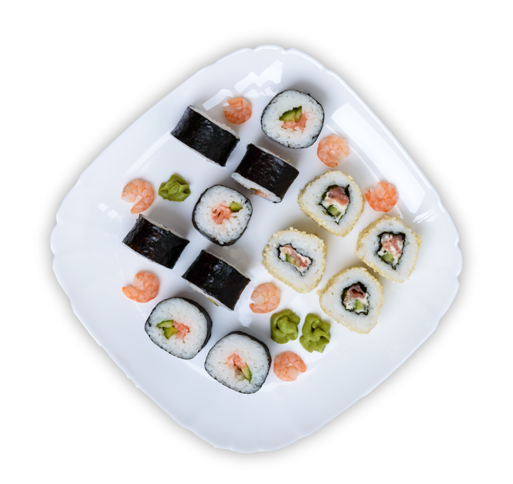 Sushi platter with maki rolls, shrimp, and wasabi