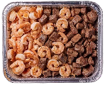 A clear aluminum tray containing cooked shrimp on one side and diced cooked beef on the other. The shrimp are pink and arranged neatly, while the beef is brown and cubed, filling half of the tray each.